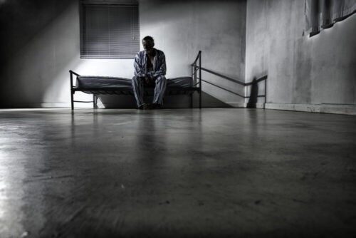 Old man in an asylum