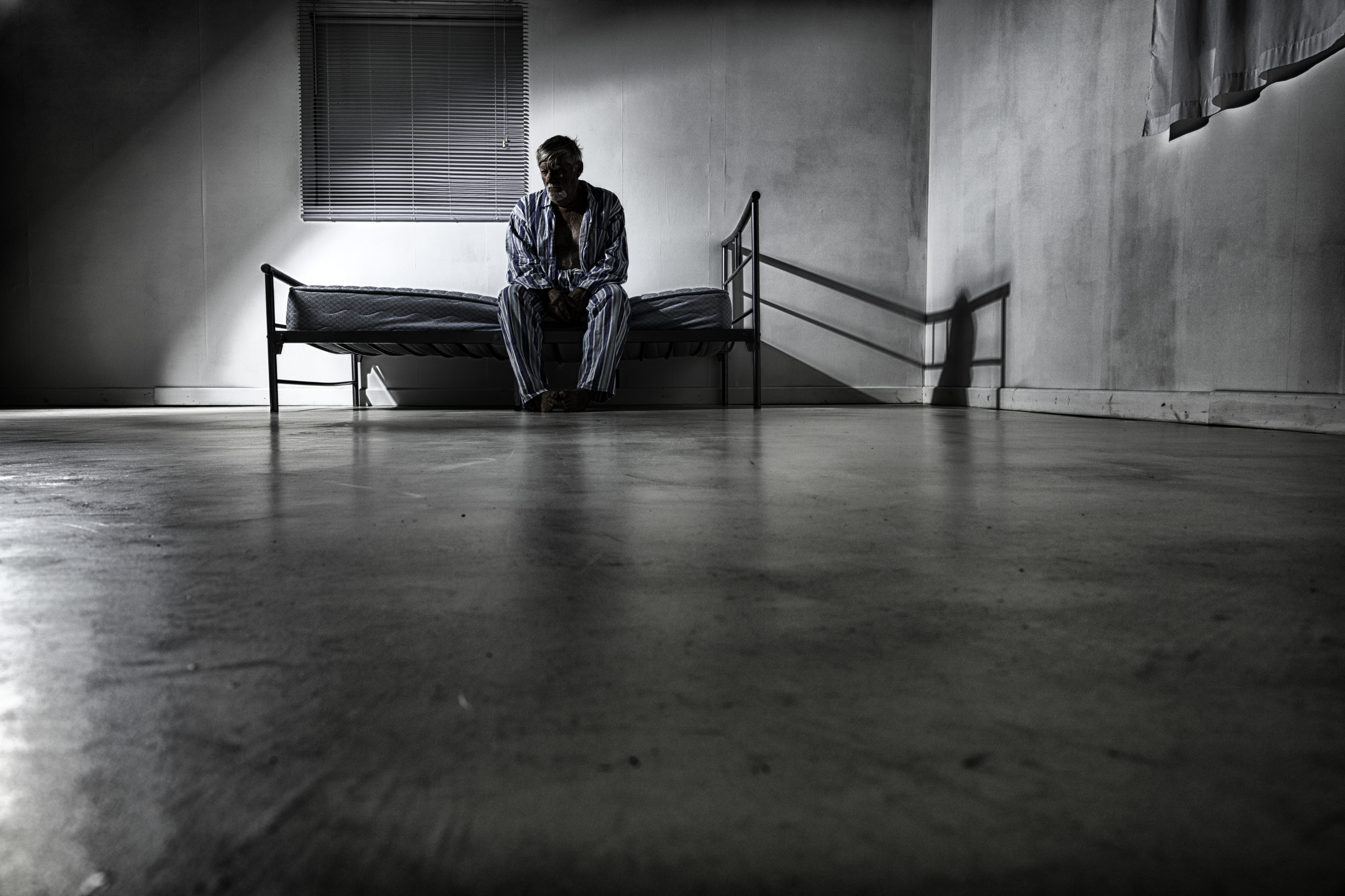 Old man in an asylum